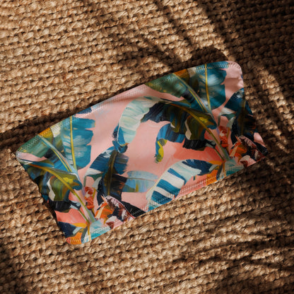 Floral-patterned pouch on a textured woven surface