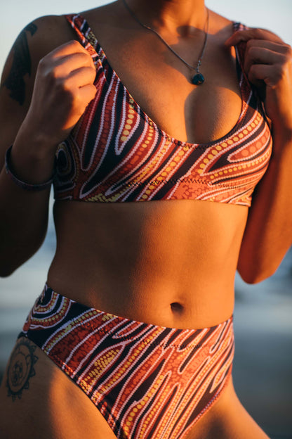 Red earth by Francine Kulitja Padded Sustainable Top - PaletTheory