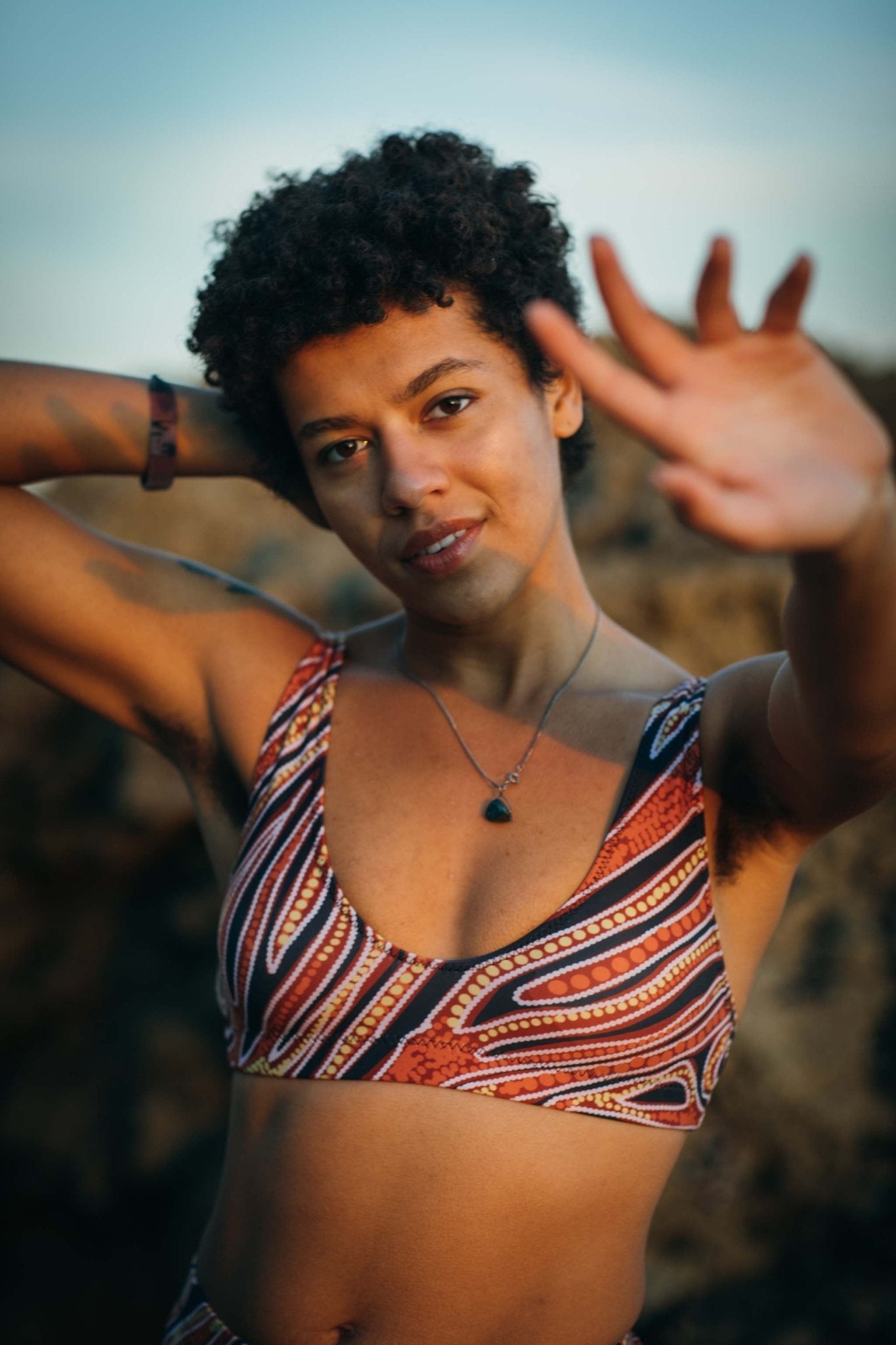 Red earth by Francine Kulitja Padded Sustainable Top - PaletTheory